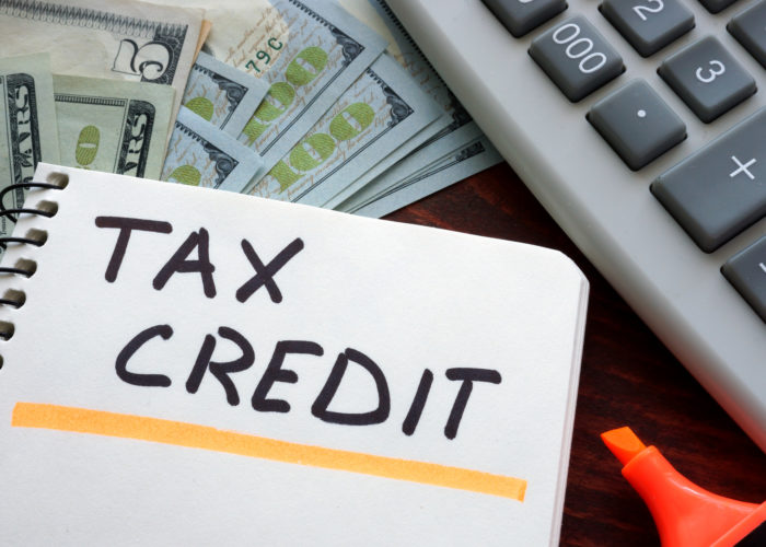 Notebook with tax credit sign on a table. Business concept. Notebook with tax credit sign on a table. Business concept.