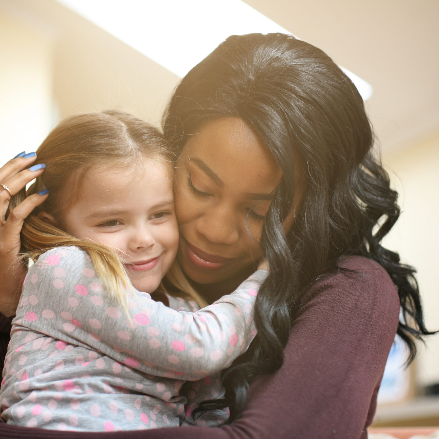 African American woman with child. how to become a foster parent