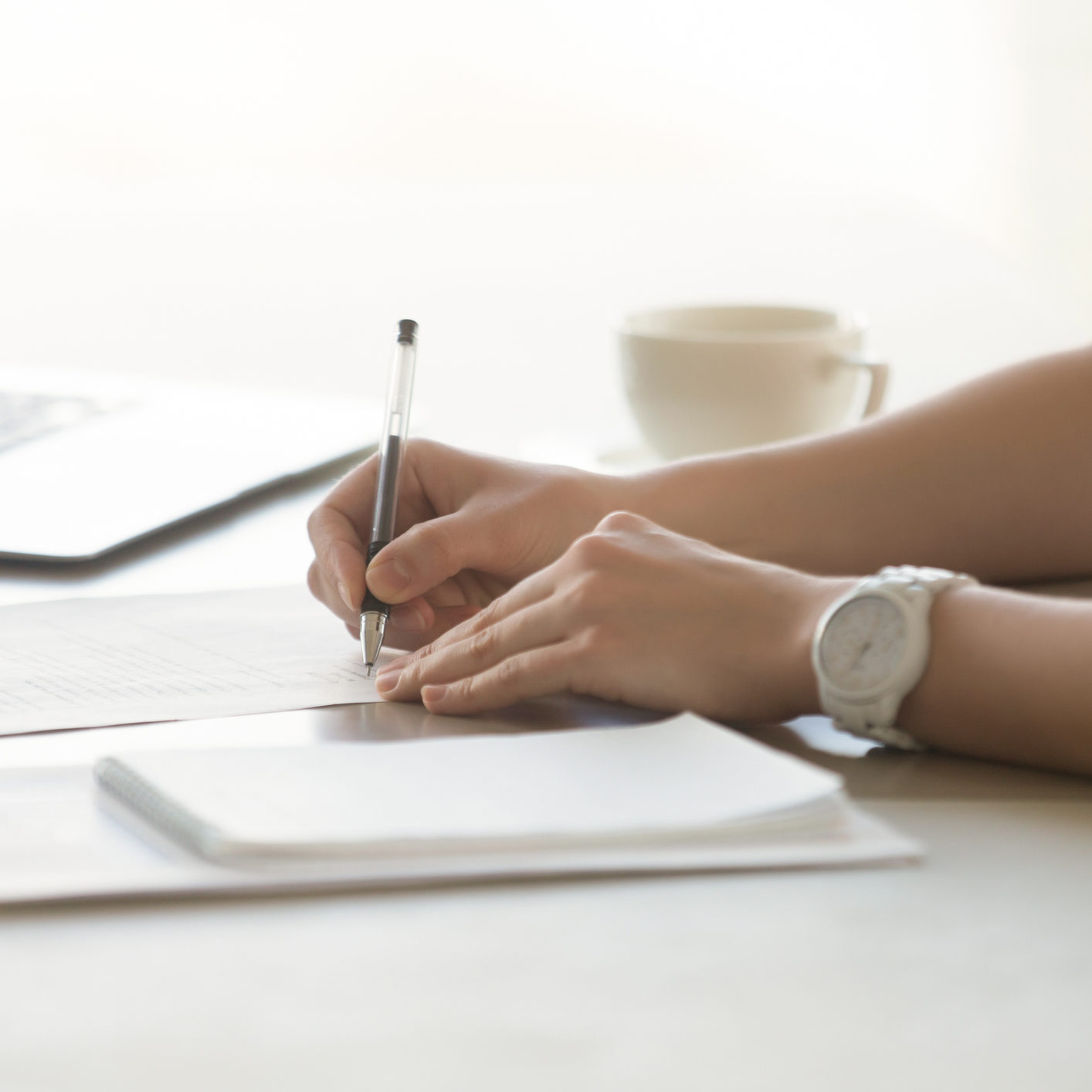 Photo of womans hands with pen signs contract become a foster parent
